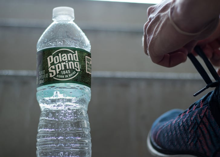 Poland Spring water and runner foot
