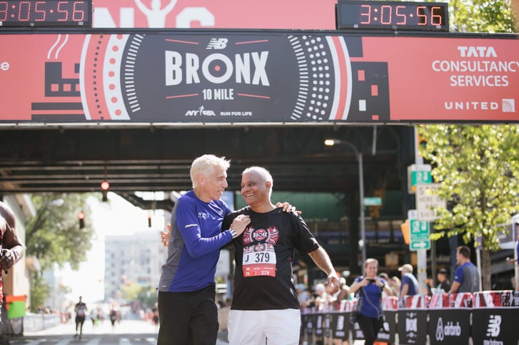 Peter Ciaccia with a Bronx 10 Miler runner