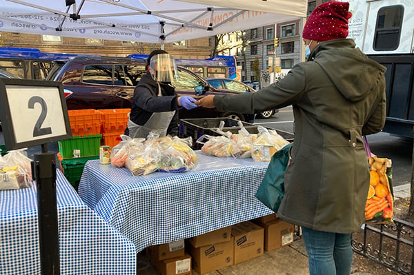West Side Campaign Against Hunger volunteer and client