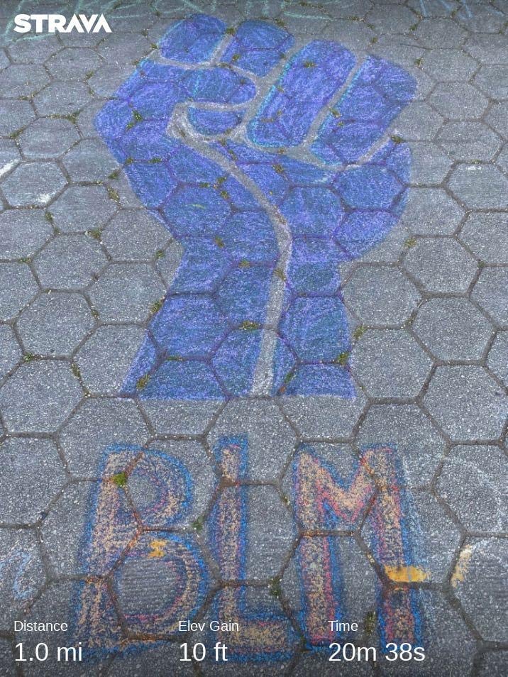 BLM chalk drawing on cobblestones