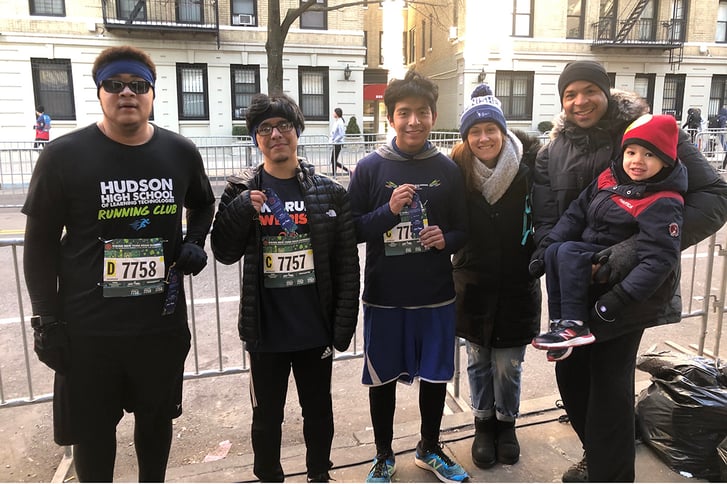 Vanessa DiServio with students after an NYRR race