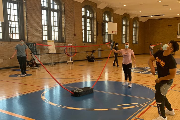 Vanessa DiServio teaching PE class in a gym