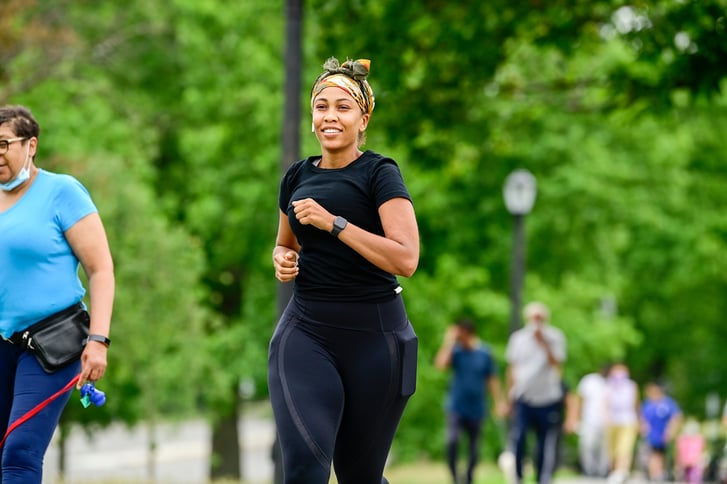 Woman runs on a trail