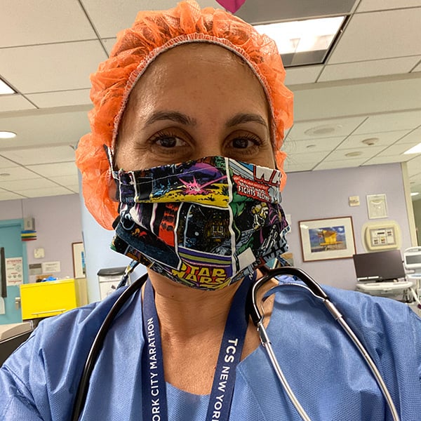 Sandra Perez in medical gear including mask