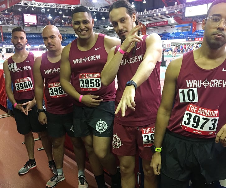 We Run Uptown Crew runners trackside at the Armory