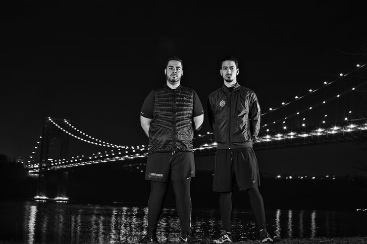 We Run Uptown Crew Josh Mock and Hector Espinal in front of bridge