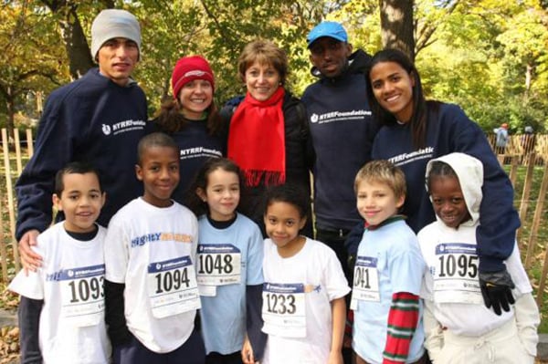 Grete Waitz and other pro athletes with New York Road Runners Foundation youth