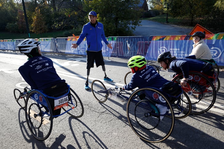Instructor and kids in NYRR youth wheelchair training program