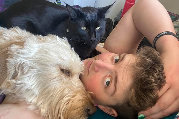 Julia Beckley with dog and cat