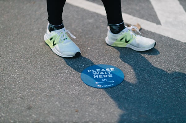 Runner feet and social distancing 6 feet decal on pavement