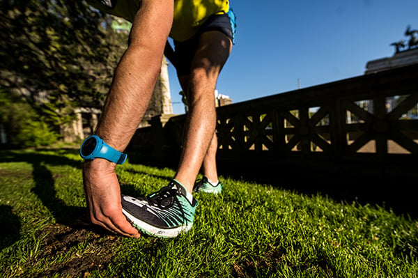 Runner stretching in Prospect Park Brooklyn