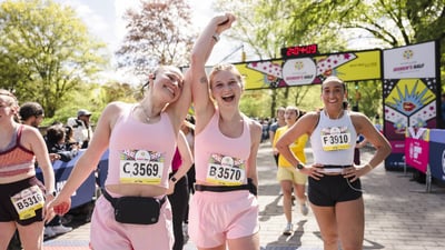 Runners cross the finish line at the Maybelline Women's Half in Central Park