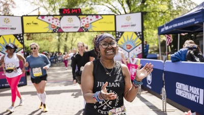 Runners cross the finish line at the Maybelline Women's Half in Central Park