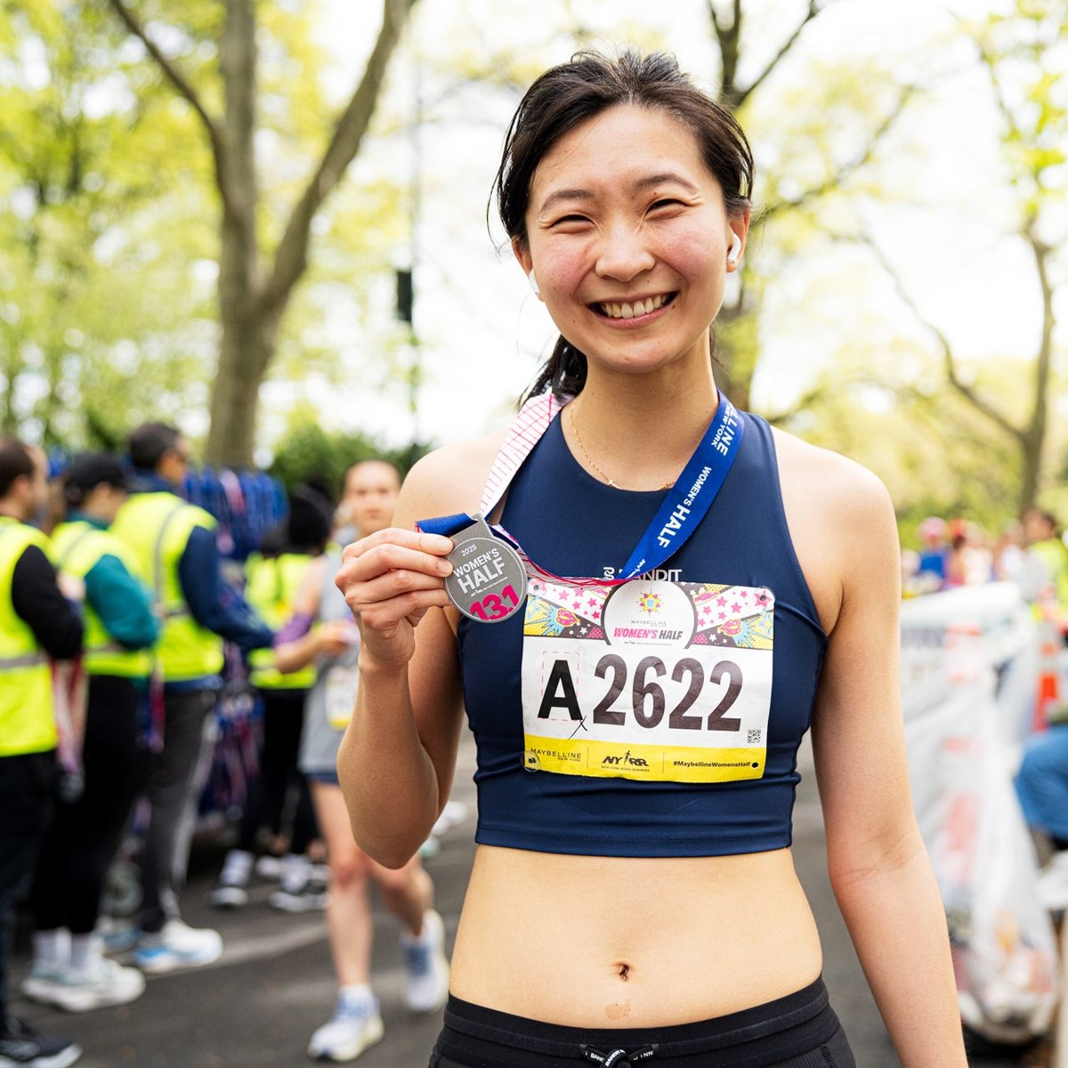 Runners cross the finish line at the Maybelline Women's Half in Central Park