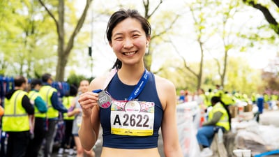 Runners cross the finish line at the Maybelline Women's Half in Central Park