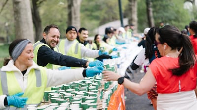 Runners cross the finish line at the Maybelline Women's Half in Central Park