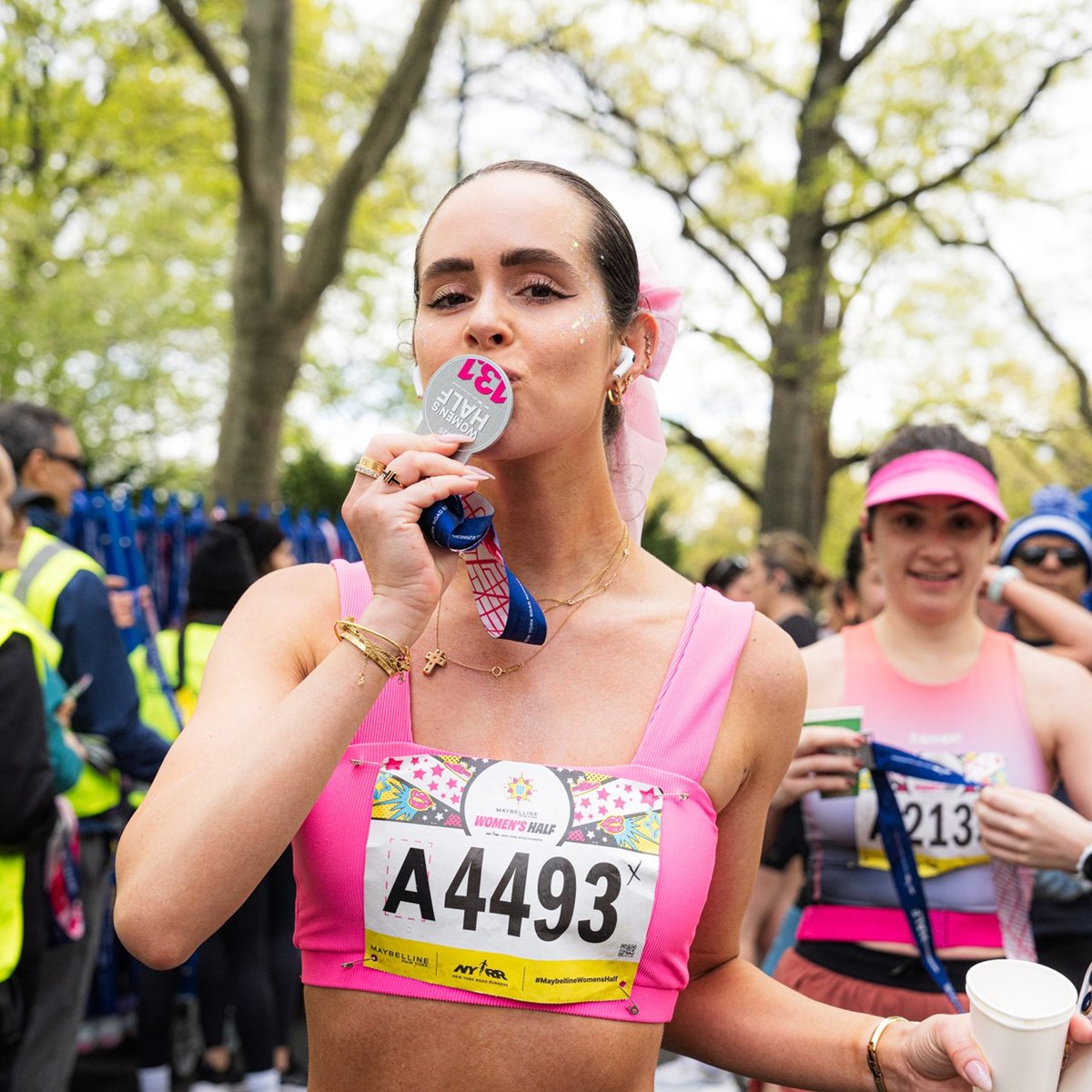 Runners cross the finish line at the Maybelline Women's Half in Central Park