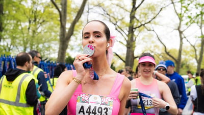 Runners cross the finish line at the Maybelline Women's Half in Central Park