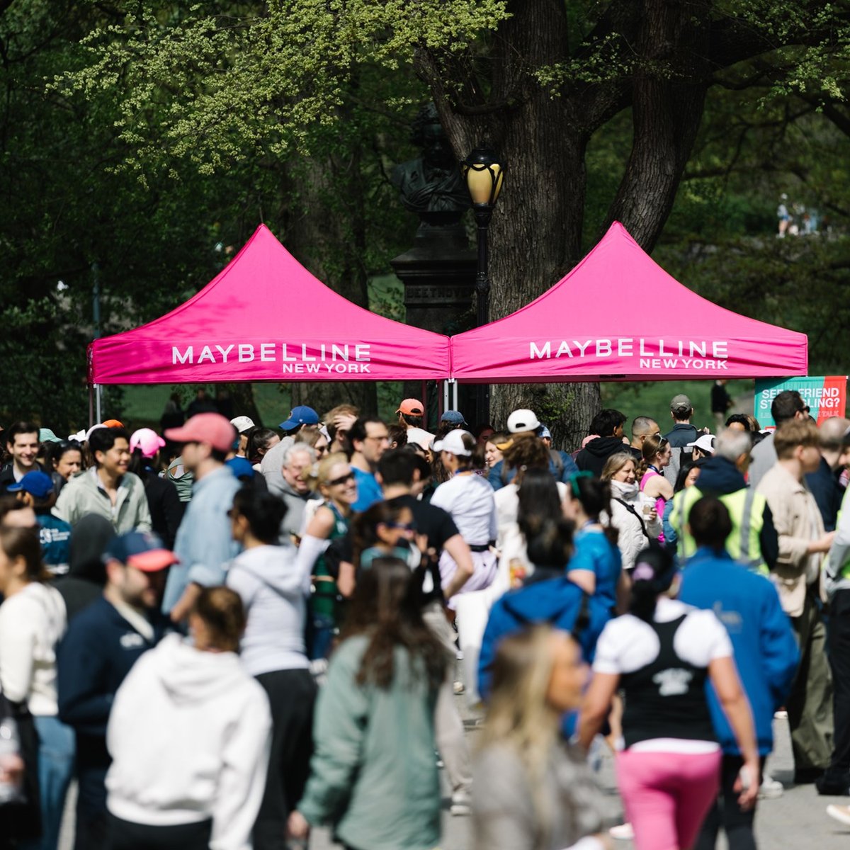 Runners cross the finish line at the Maybelline Women's Half in Central Park