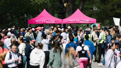 Runners cross the finish line at the Maybelline Women's Half in Central Park