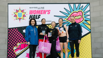 Runners cross the finish line at the Maybelline Women's Half in Central Park