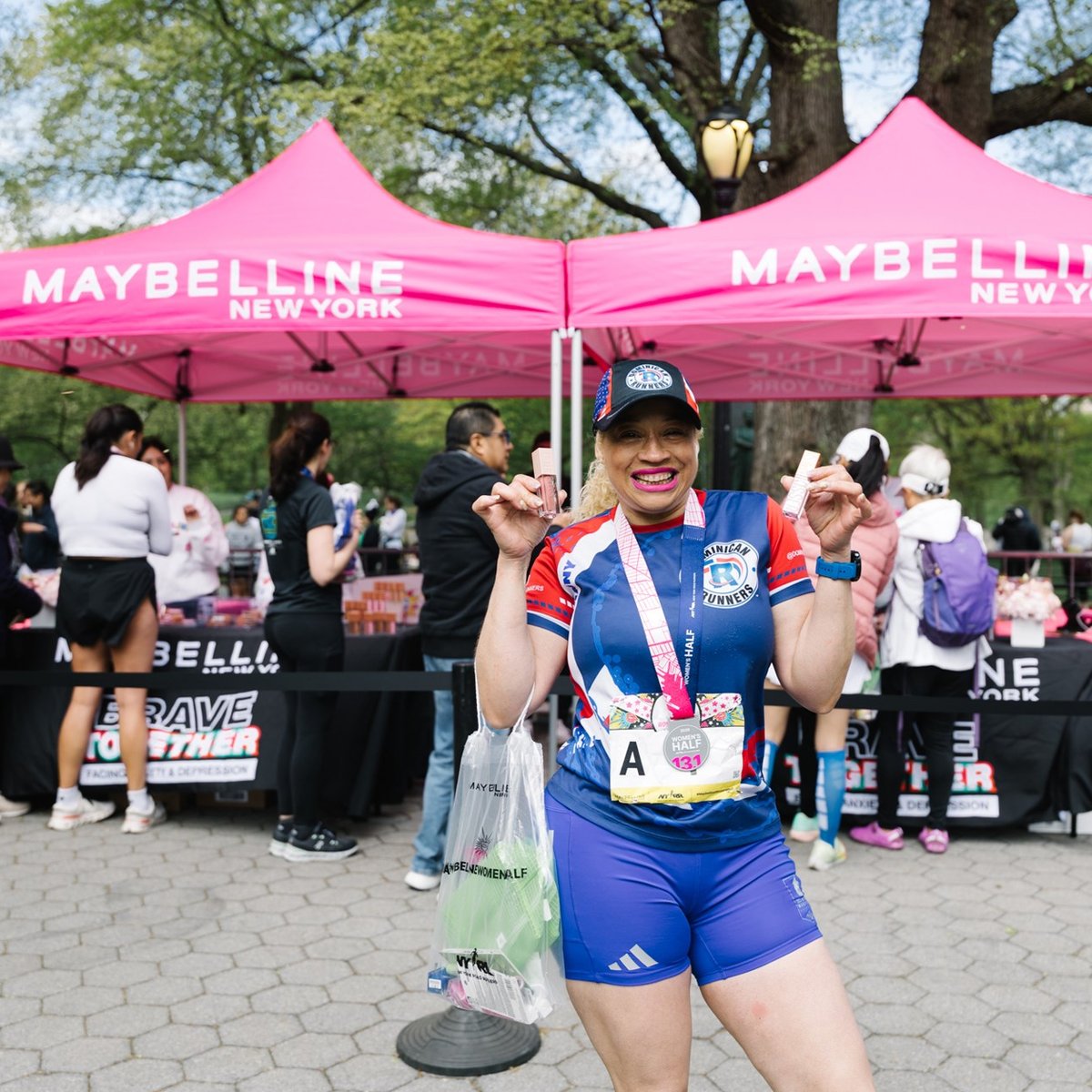 Runners cross the finish line at the Maybelline Women's Half in Central Park