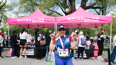 Runners cross the finish line at the Maybelline Women's Half in Central Park