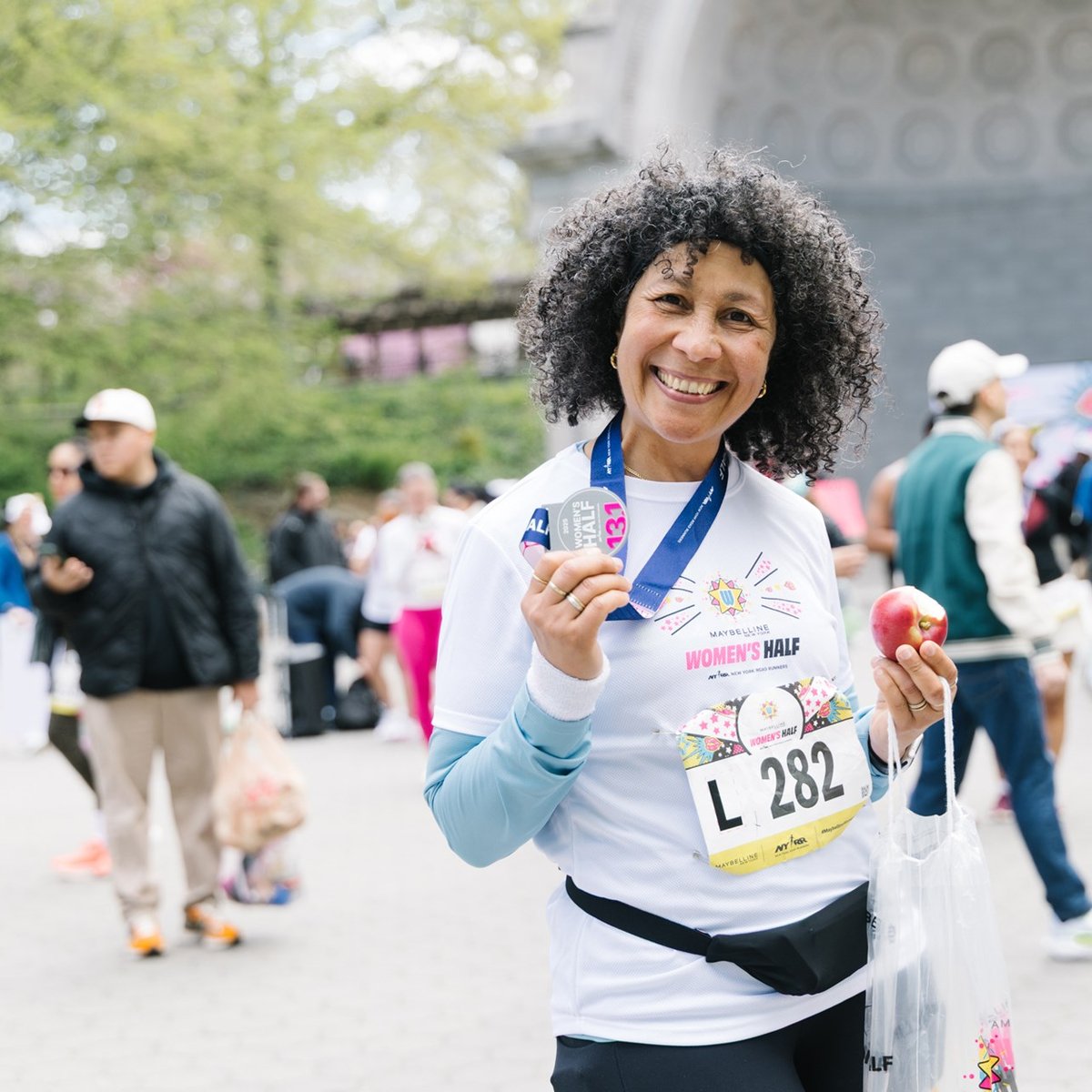 Runners cross the finish line at the Maybelline Women's Half in Central Park