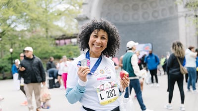 Runners cross the finish line at the Maybelline Women's Half in Central Park