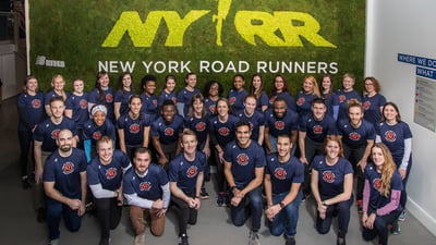 A group photo of Rising New York Road Runners participants and leaders with Ambassador Jenny Simpson.