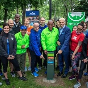 New York Road Runners and NYC Parks staff at a groundbreaking for Mile Markers in Astoria Park in Queens