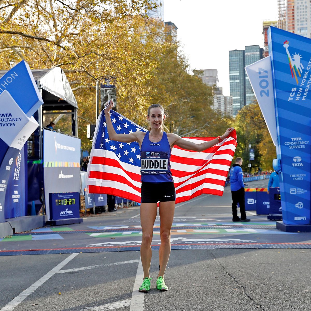 Molly Huddle holding a flag