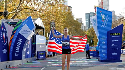 Molly Huddle holding a flag