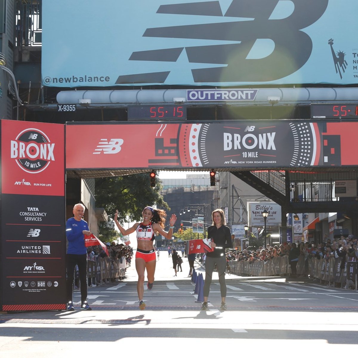 Beverly Ramos crossing the finish line.