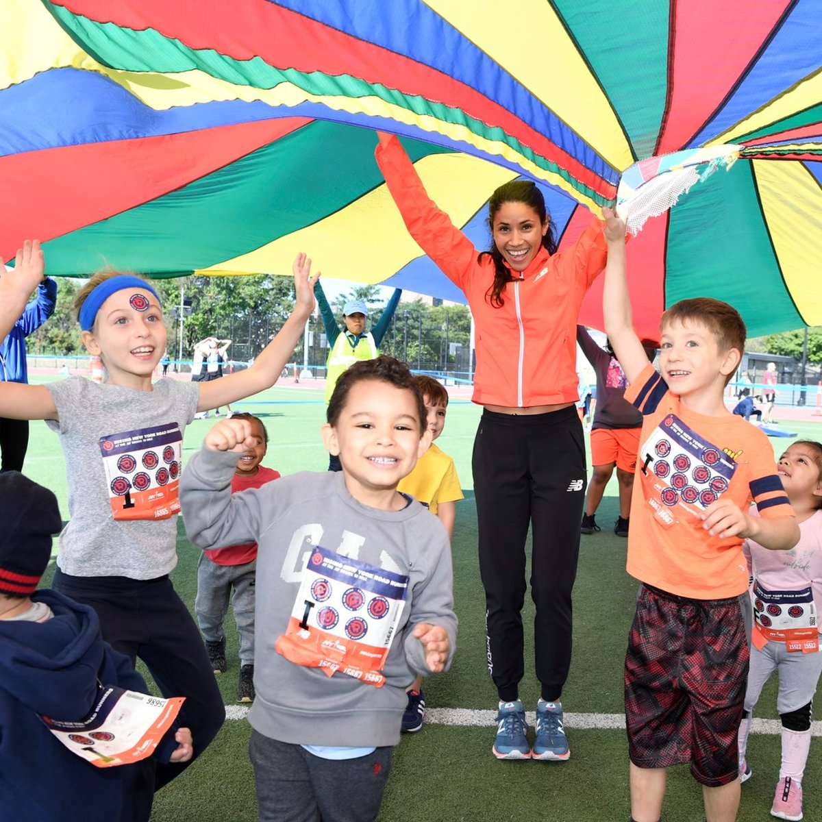 Beverly Ramos plays field games with youth runners