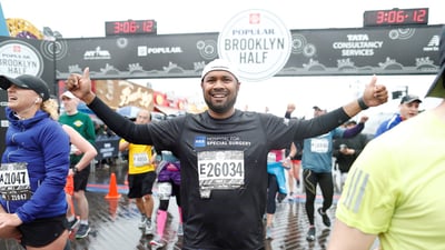 NYRR Team for Kids Ambassador Sam Ryan finishes the 2018 Popular Brooklyn Half
