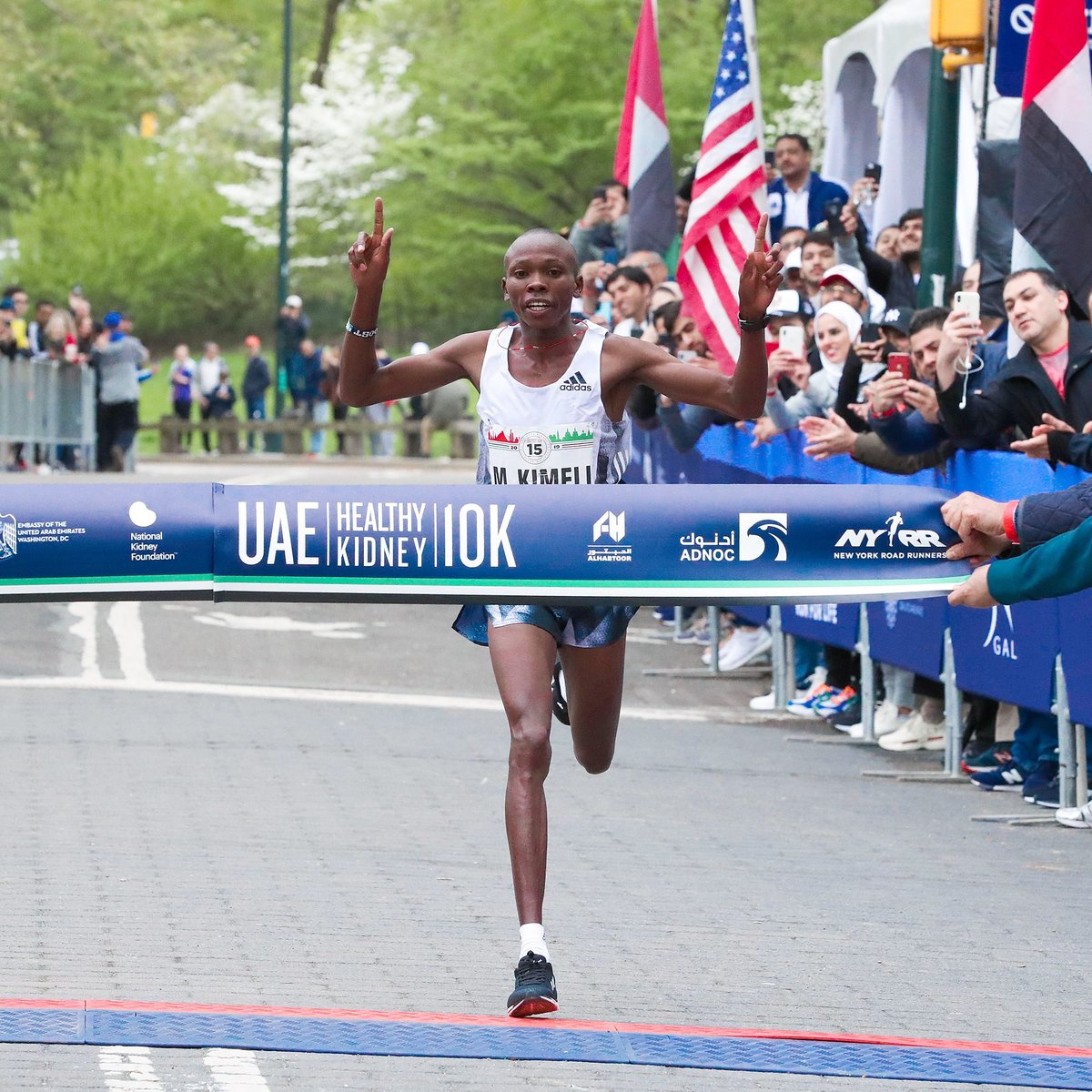 Men's first place finisher Mathew Kimeli crosses the finish line.