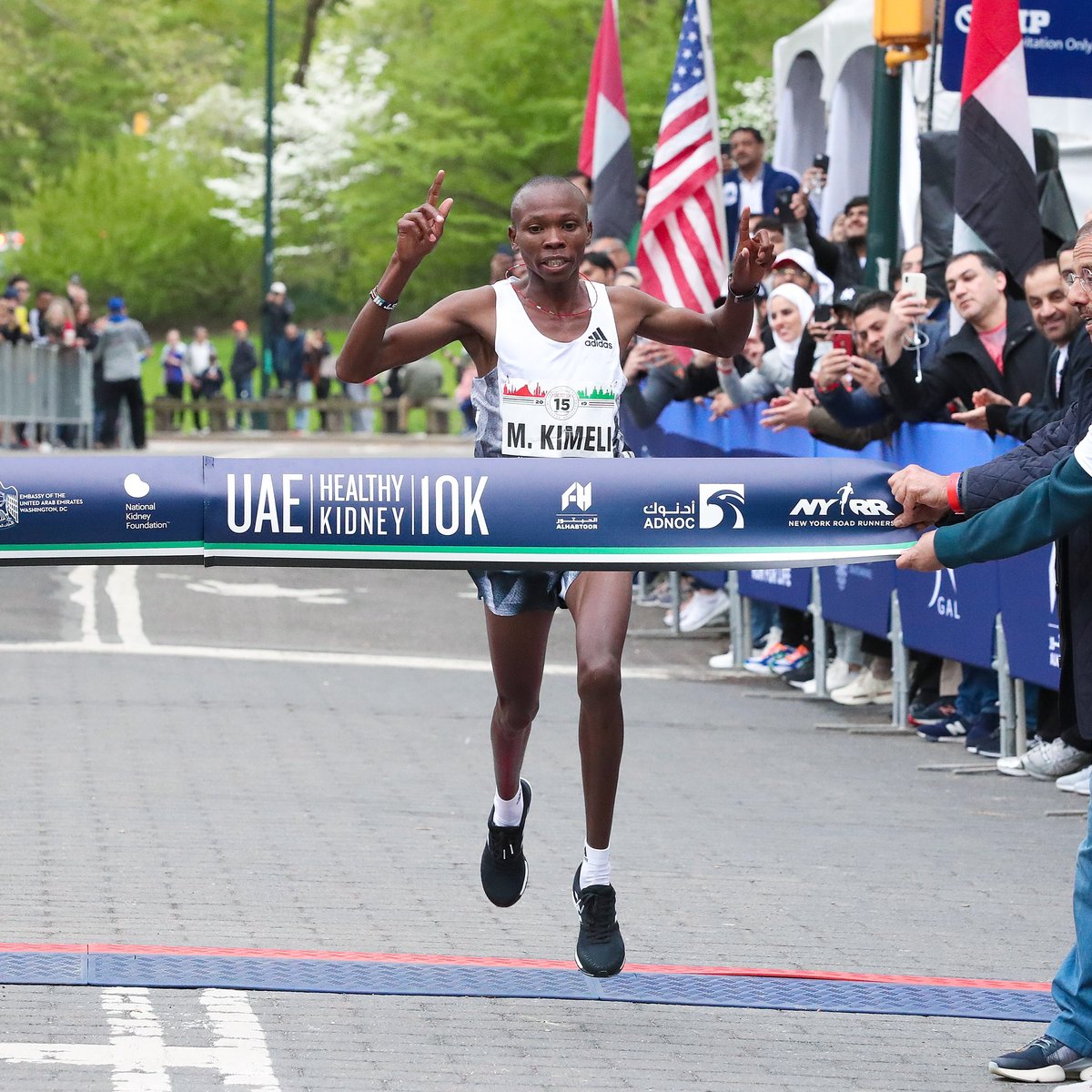 Men's first place finisher Mathew Kimeli crosses the finish line.