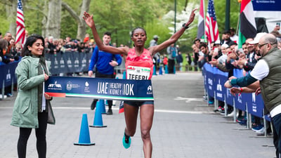 Women's first place finisher Senbere Teferi crosses the finish line.