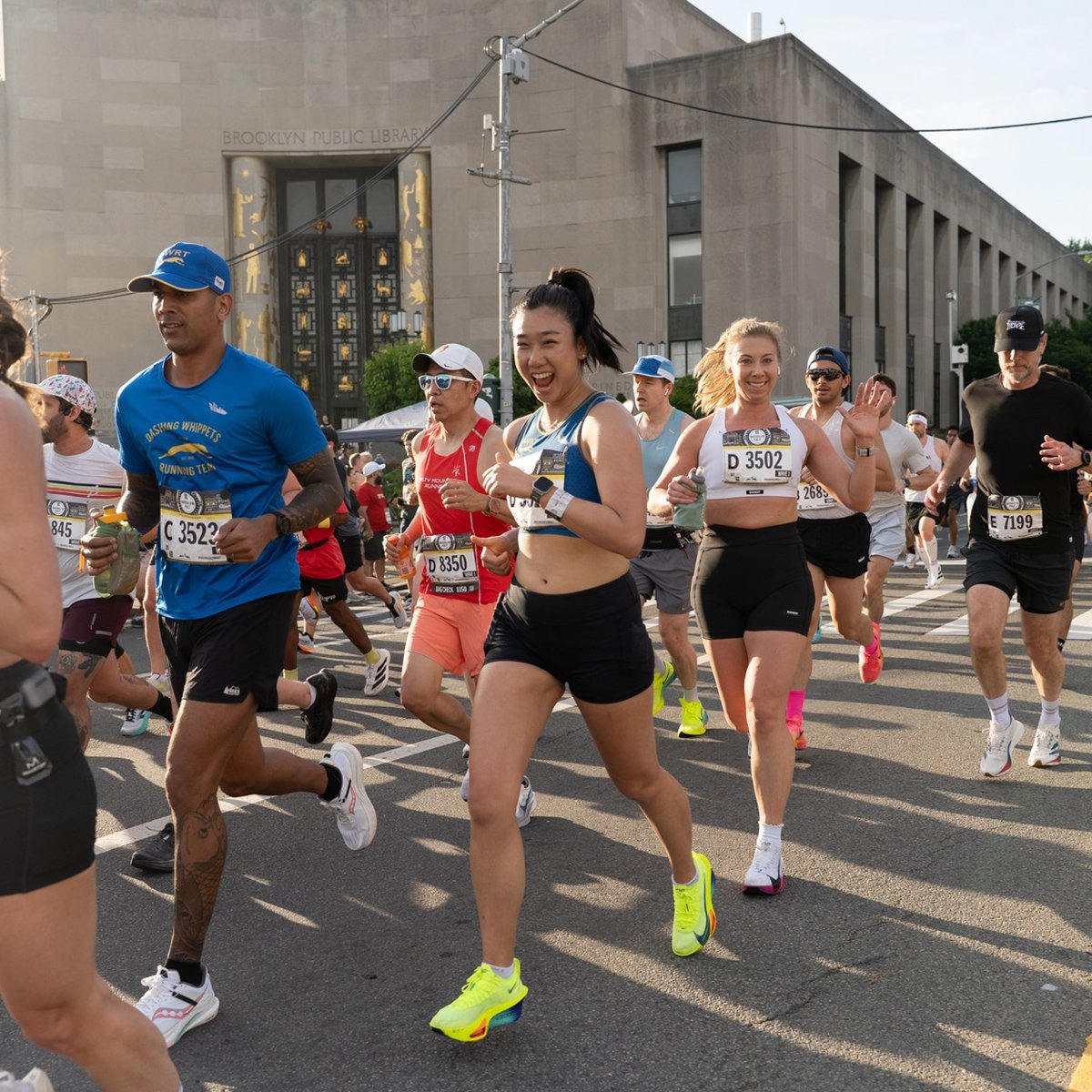 Runners run past the Brooklyn Library during the RBC Brooklyn Half