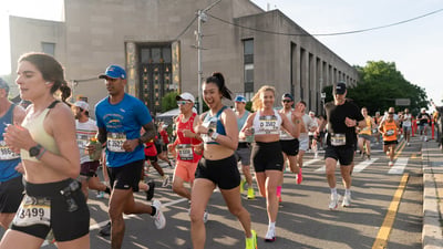 Runners run past the Brooklyn Library during the RBC Brooklyn Half