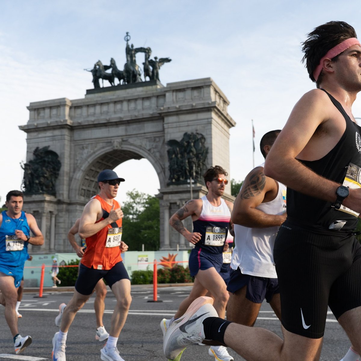 Runners run by Grand Army Plaza in Brooklyn during the RBC Brooklyn Half