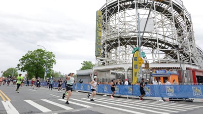 Runners run past the cyclone at the RBC Brooklyn Half