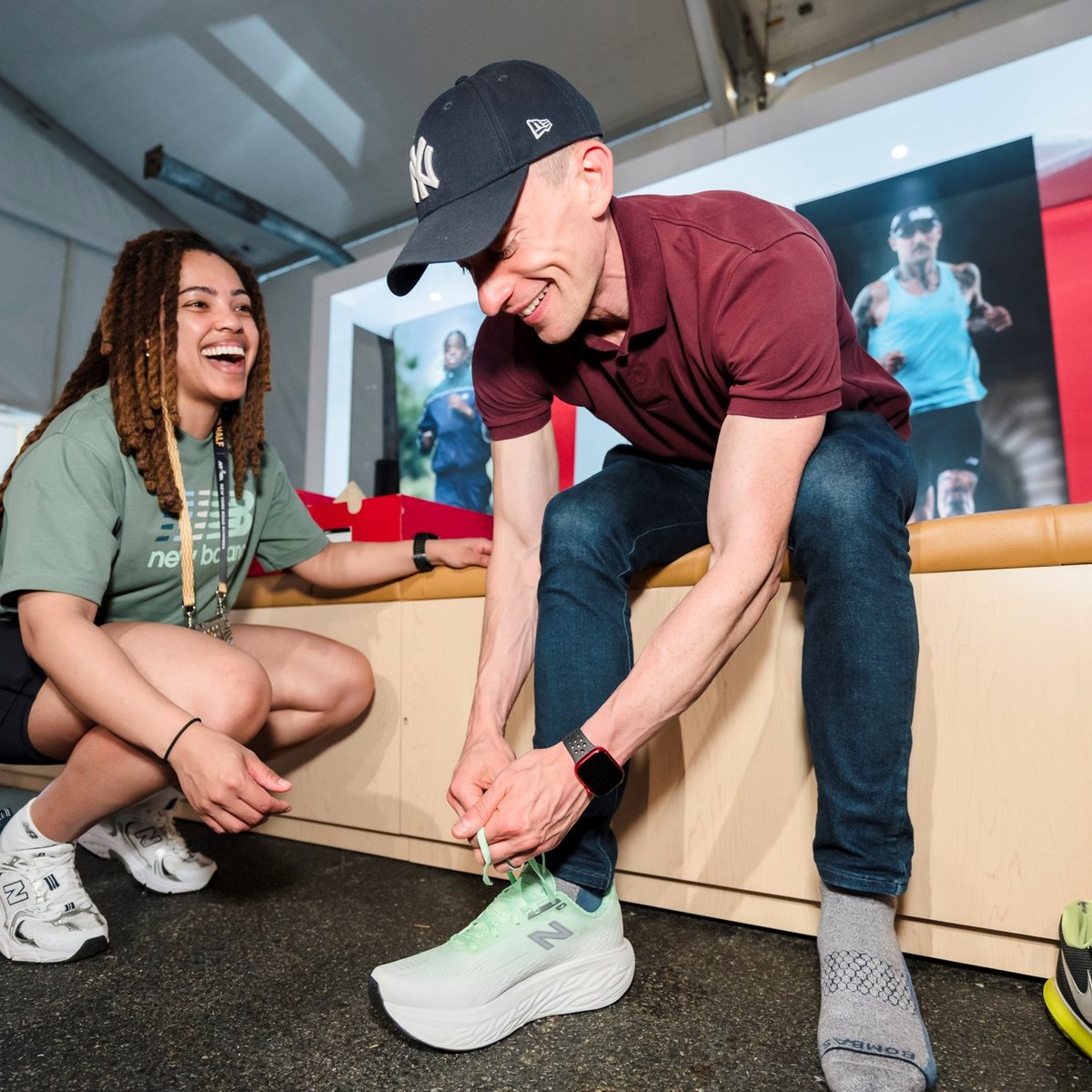 A man tries on New Balance sneakers at the 2025 RBC Brooklyn Half Pre-Party