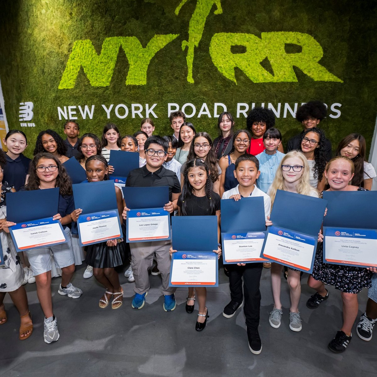 Youth ambassadors and their certificates at graduation