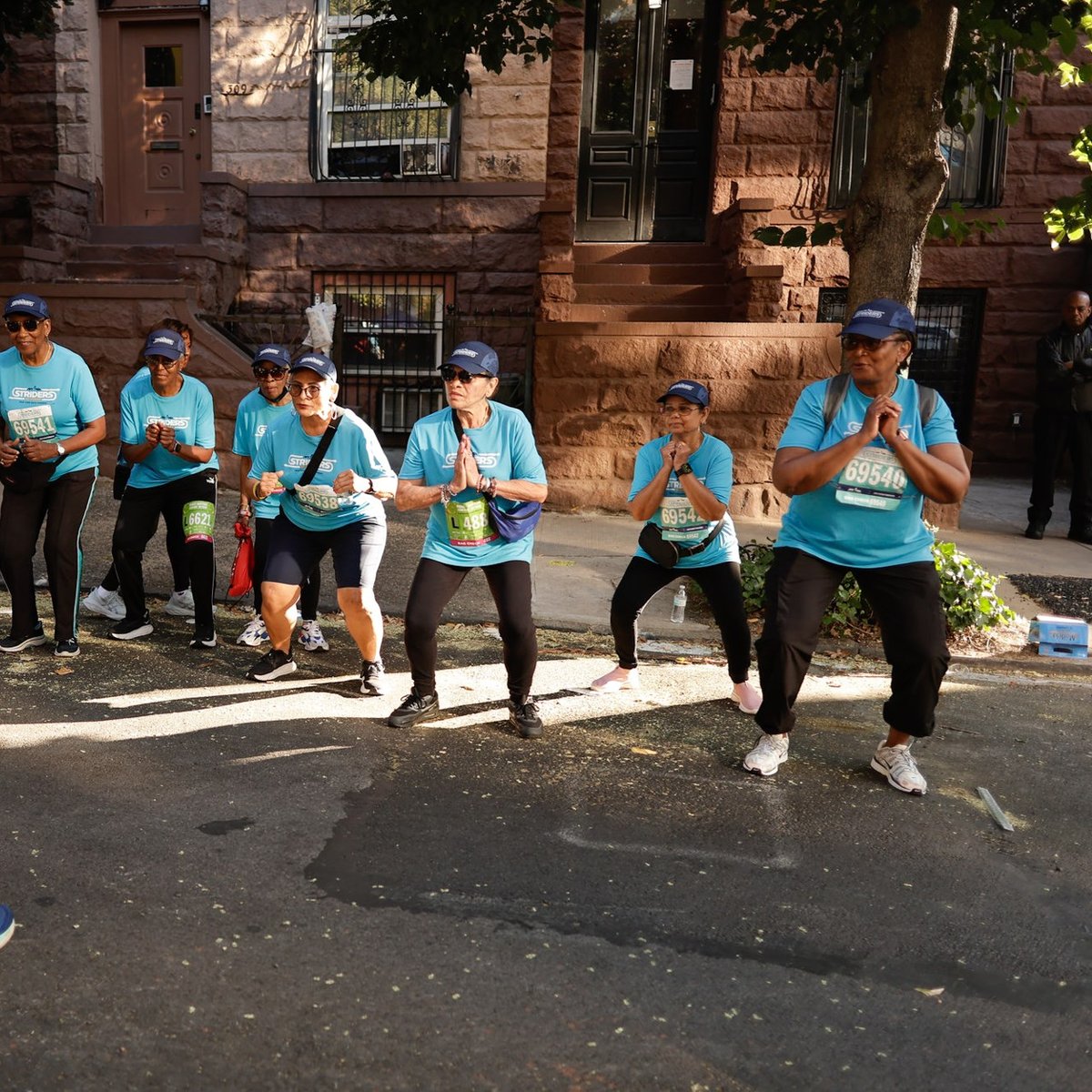 Harlem 5K participants with coach