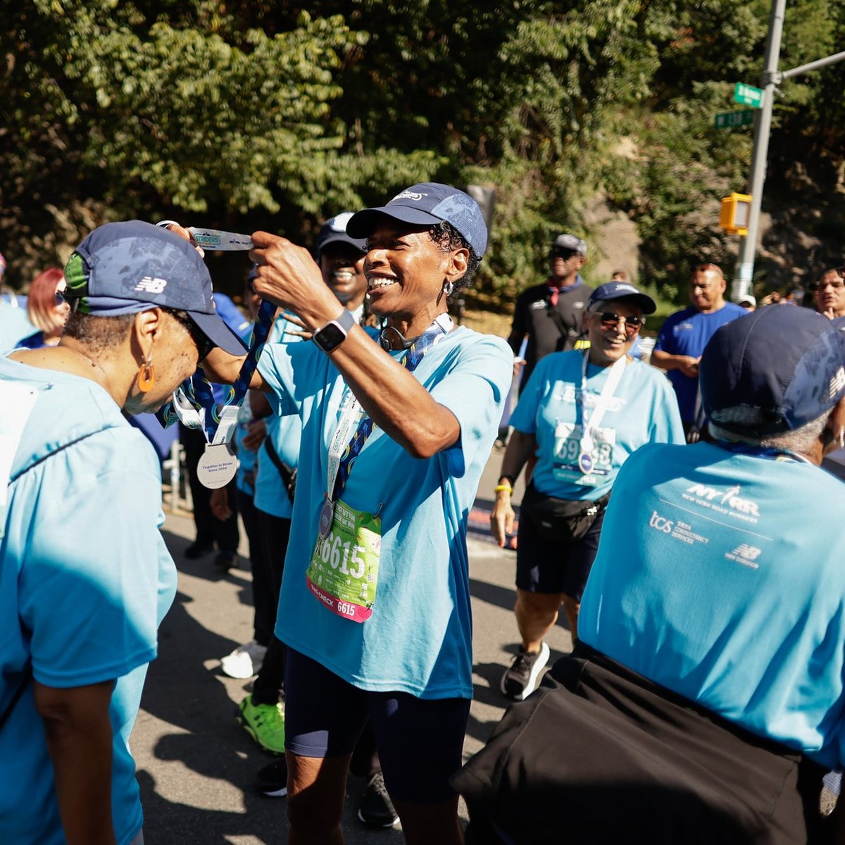 Harlem 5K participant receiving medal