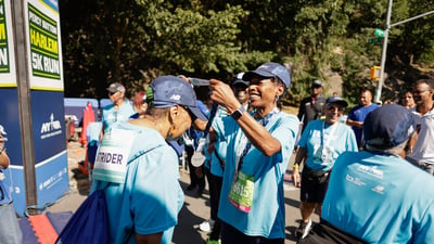 Harlem 5K participant receiving medal