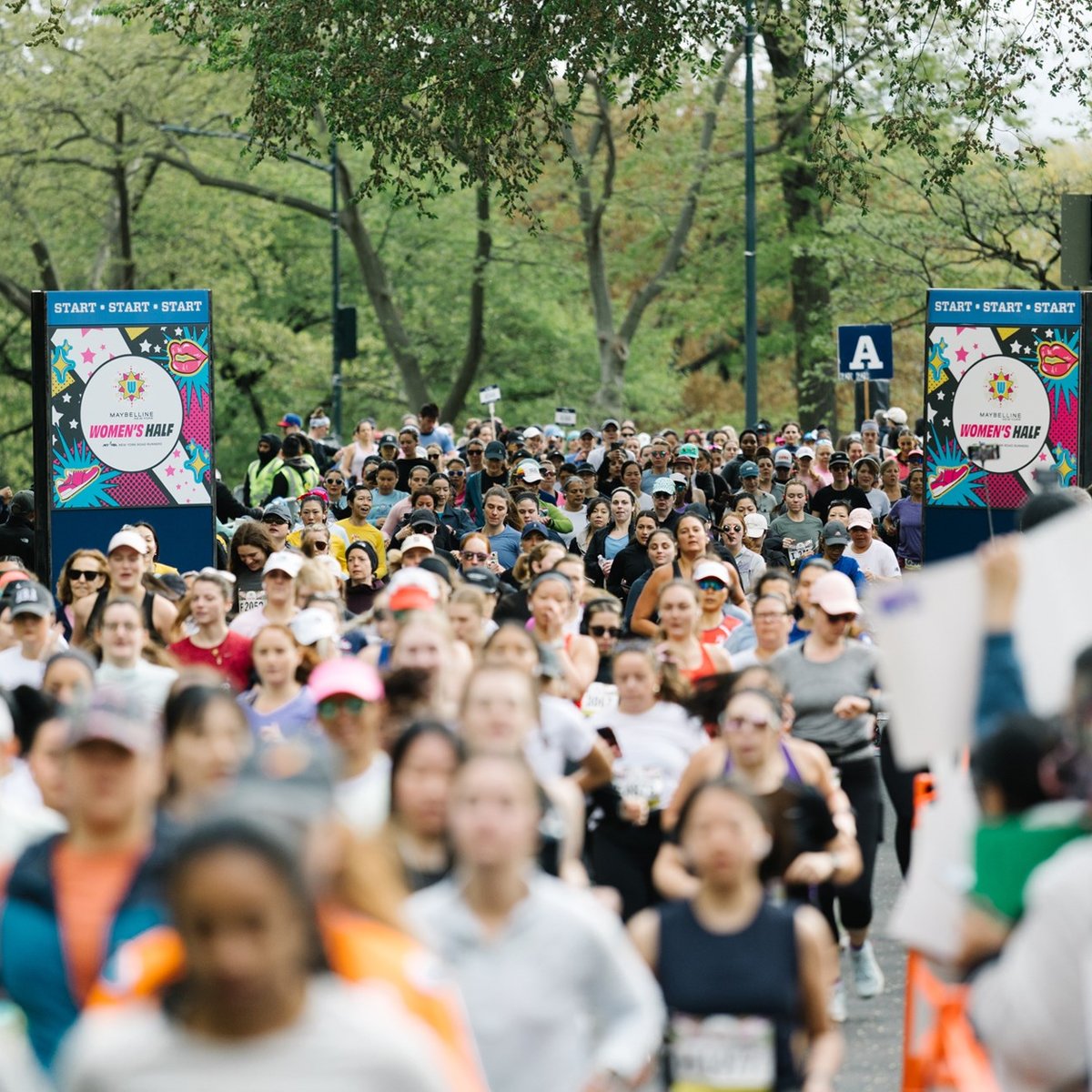 Runners at the Maybelline Women's Half start line