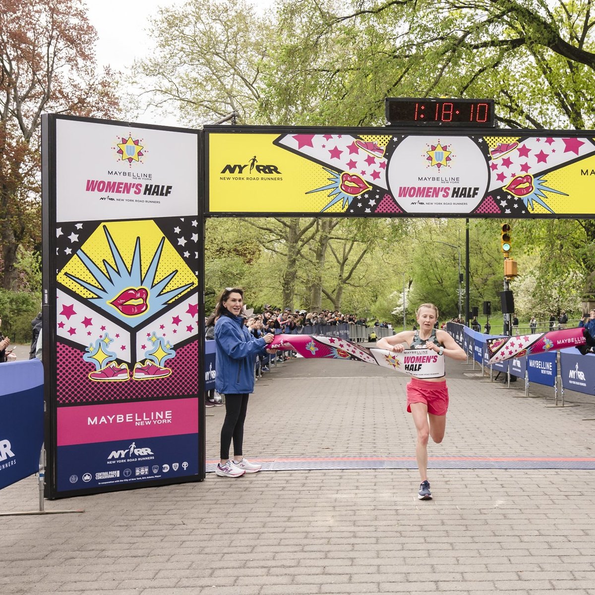 Runner breaks tape at the Maybelline Women's Half in Central Park